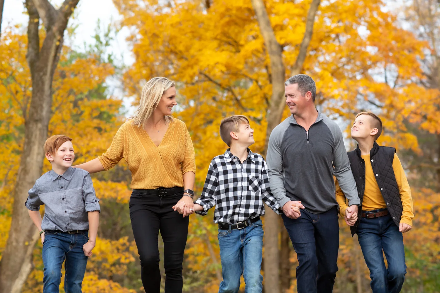 Family of four walking in fall color
