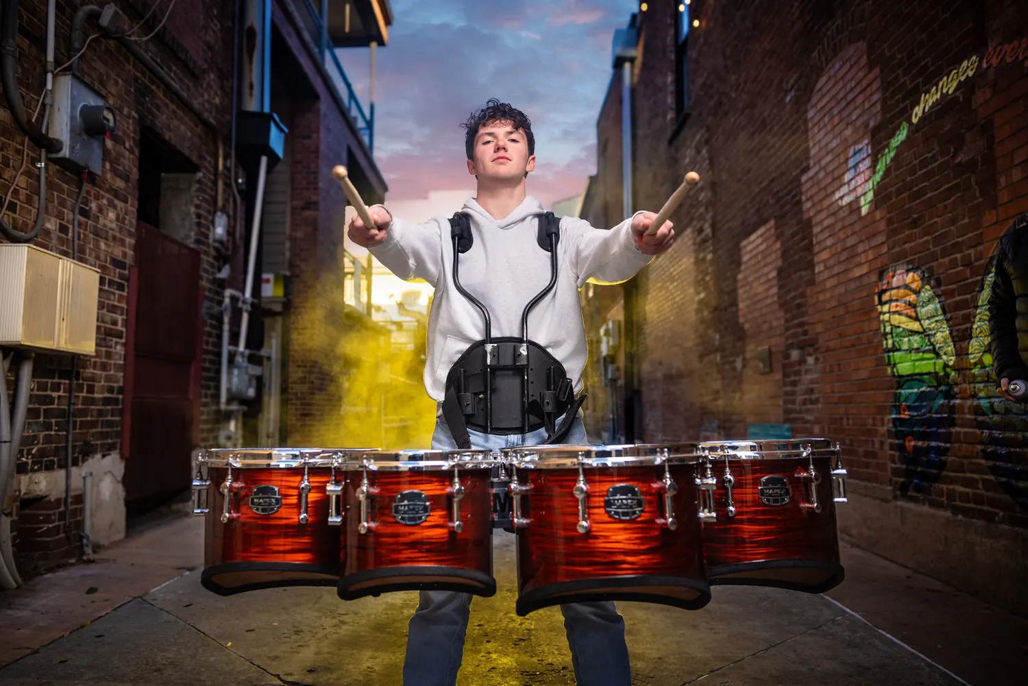 Senior drummer portrait in the alley