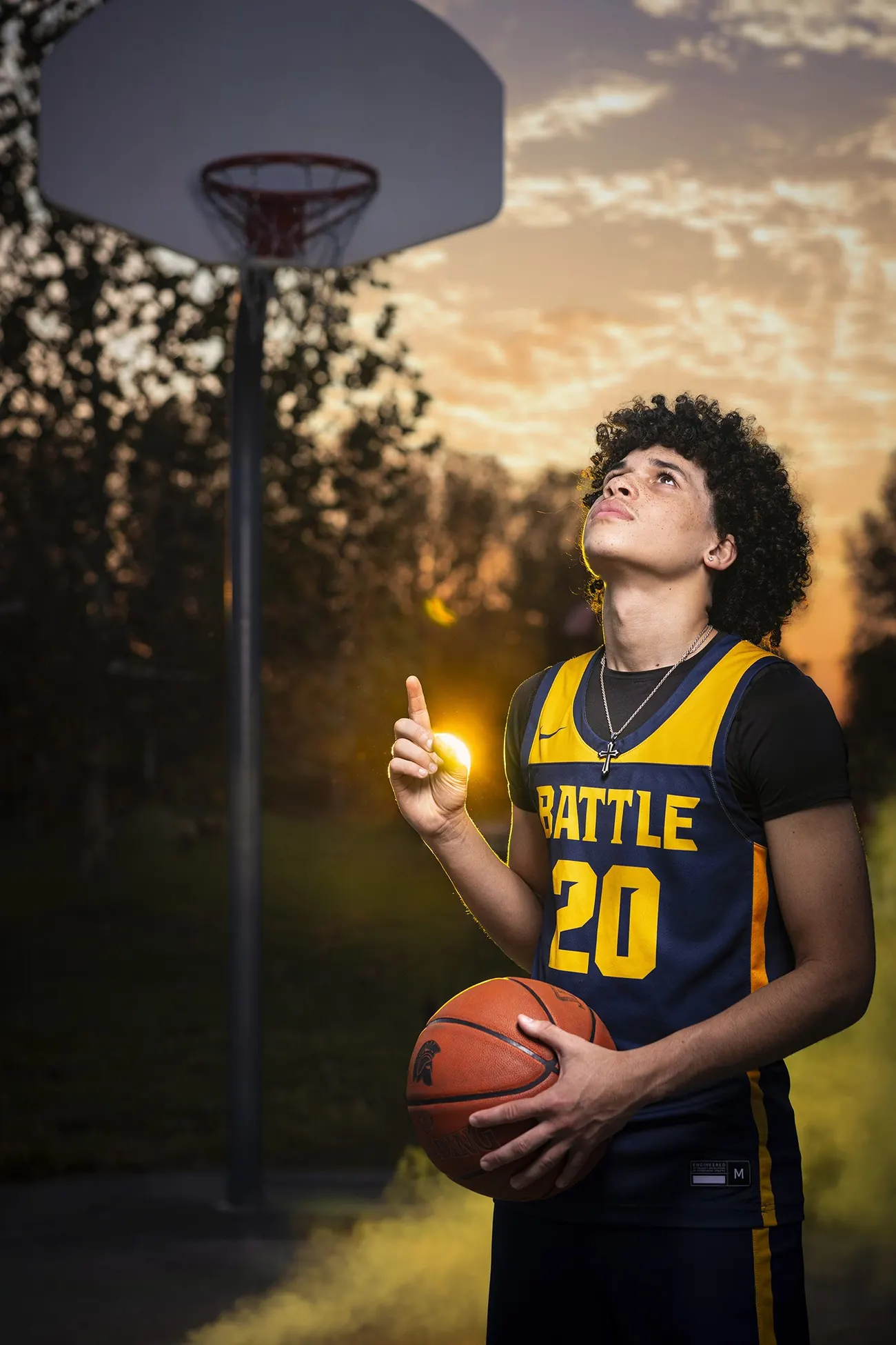 Senior basketball portrait at sunset
